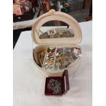 A jewellery box with a mixed lot of brooches and badges