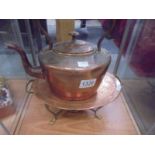 A copper food warmer with burner and a copper kettle.