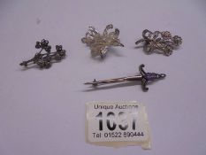 Three silver floral spray brooches and one other. 18.5 grams.
