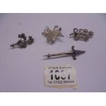 Three silver floral spray brooches and one other. 18.5 grams.