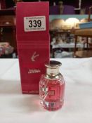 A partially used bottle of Scandal by Jean Paul Gaultier in box (approximately 3/4 full)