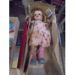 A boxed Cosmopolitan 'Ginger' walker doll.