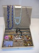 A jewellery box with a good lot of costume jewellery.