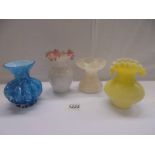 Four good old glass vases including blue overlaid and yellow frill top examples.