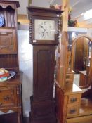 An oak cased eight day Grandfather clock, COLLECT ONLY.