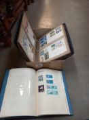 An album of FDC first day covers and a stamp album and contents