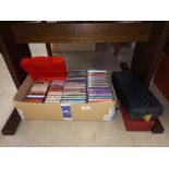 A box of cd's and cassette tapes
