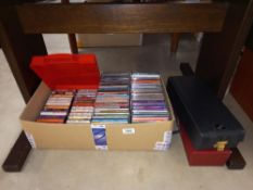 A box of cd's and cassette tapes