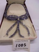A tanzanite four strand necklace with silver mounts.