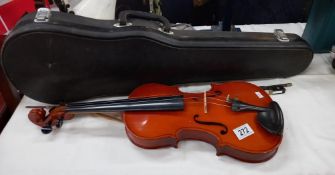 A violin in hard case, Chinese copy of a Stradivarius COLLECT ONLY