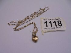 A 9ct gold heart locket on chain, 2 grams.