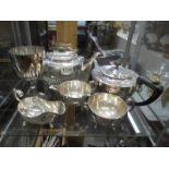 A mixed lot of silver plate including teapots, goblet etc.,