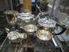 A mixed lot of silver plate including teapots, goblet etc.,