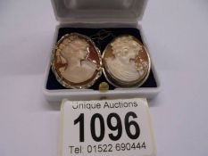 Two shell cameo female profile brooches.