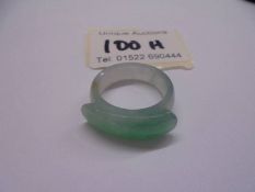 A jade saddle ring, size T.