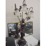 A figural double light table lamp with glass shades, COLLECT ONLY.