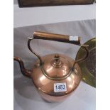 A Victorian copper kettle.