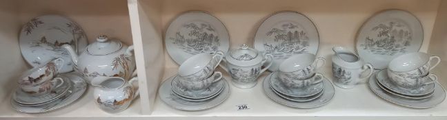 An Oriental china tea set plus two trios and a teapot