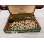 A quantity of bead necklaces and a cased row of pearls