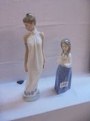 Two NAO by Lladro figurines.