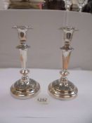 A pair of silver plate on copper candlesticks, 21cm, (plate worn)
