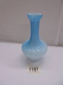 An antique blue satin glass vase, 15 cm tall.