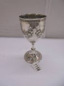An embossed silver goblet, hallmarked Birmingham 1868/69, maker S W, 16 cm tall, 5.3 ounces.