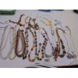Sixteen assorted necklaces.