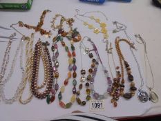 Sixteen assorted necklaces.