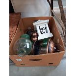 A box of garden decorative items including glass wasp trap etc