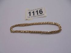 A gold identity bracelet marked Italy 375, 2.6 grams.