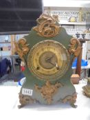 An early 20th century french heavy iron mantle clock, in working order. COLLECT ONLY.