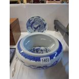 A Chinese blue and white plate and a Chinese blue and white bowl.