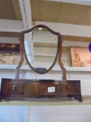 A Victorian mahogany shield shaped toilet mirror with three drawers. COLLECT ONLY.