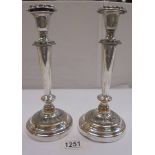 A pair of silver plate on copper candlesticks, 25cm, (plate worn)