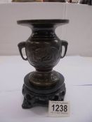 A Chinese bronze vase with makers mark to base. 12.5 cm tall.