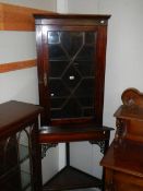 A mahogany astragal glazed corner display cabinet on stand. COLLECT ONLY.