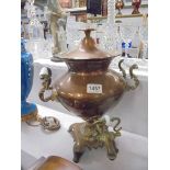 A Victorian copper samovar urn with brass fittings.