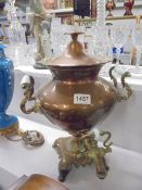 A Victorian copper samovar urn with brass fittings.