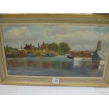 A framed oil on canvas river scene signed M L Woodcock, image 59 x 30 cm, frame 70 x 40 cm.