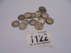 Approximately nineteen silver threepenny bits, 25.9 grams.