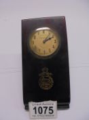 A vintage bakelite Hotel Royal Rome desk paperclip with integral clock.