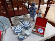 Blue and white Chinese teapots, soup bowls, spoons etc