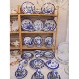 In excess of 70 pieces of 'Old Willow' tableware including Booth's, Royal Worcester, Royal Doulton,