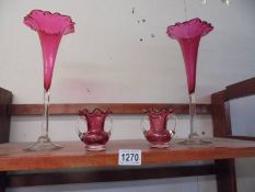 A good pair of cranberry glass spill vases and a pair of small twin handled cranberry glass vases.