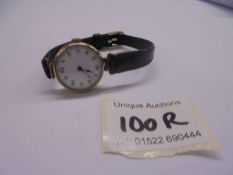 A vintage 9ct gold watch in working order.