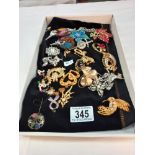 A quantity of vintage costume jewellery brooches including Scottish etc