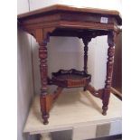 An octagonal mahogany occasional table with galleried under shelf, COLLECT ONLY.