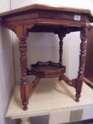 An octagonal mahogany occasional table with galleried under shelf, COLLECT ONLY.