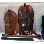 Wooden tribal masks, axe etc